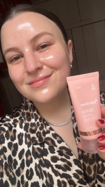 A selfie of Allure features director Dianna Mazzone Singh wearing and holding Medicube's Collagen Night Wrapping Mask