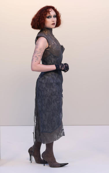 Chappell Roan posing in a lacy gray dress